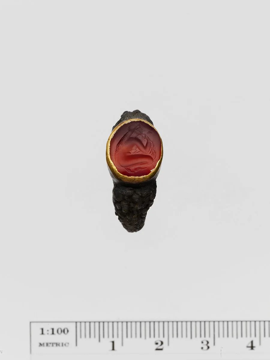 Carnelian ring stone with gold band set in a silver ring — Unknown