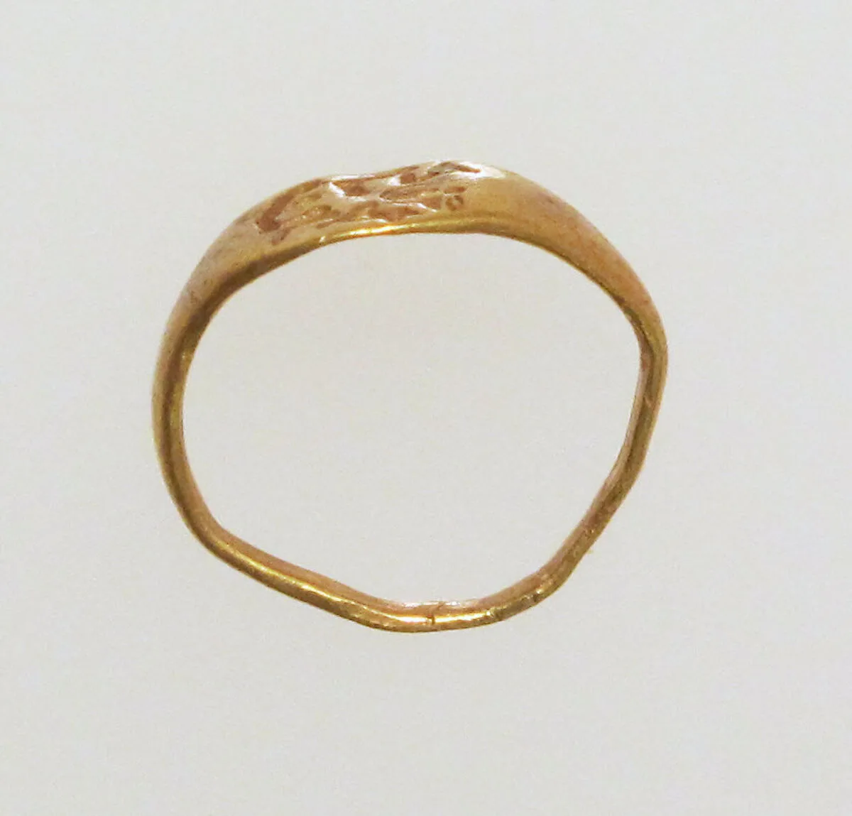 Gold ring with inscribed bezel — Unknown