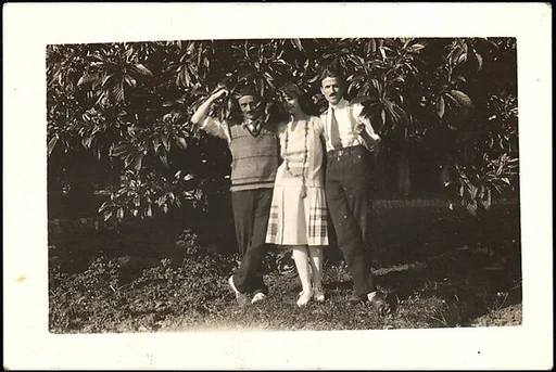[Lucien Jacques, Georgette Maury, and André Maury Standing in Front of Foliage, Les Cyprés de St. Jean par Grasse, France]