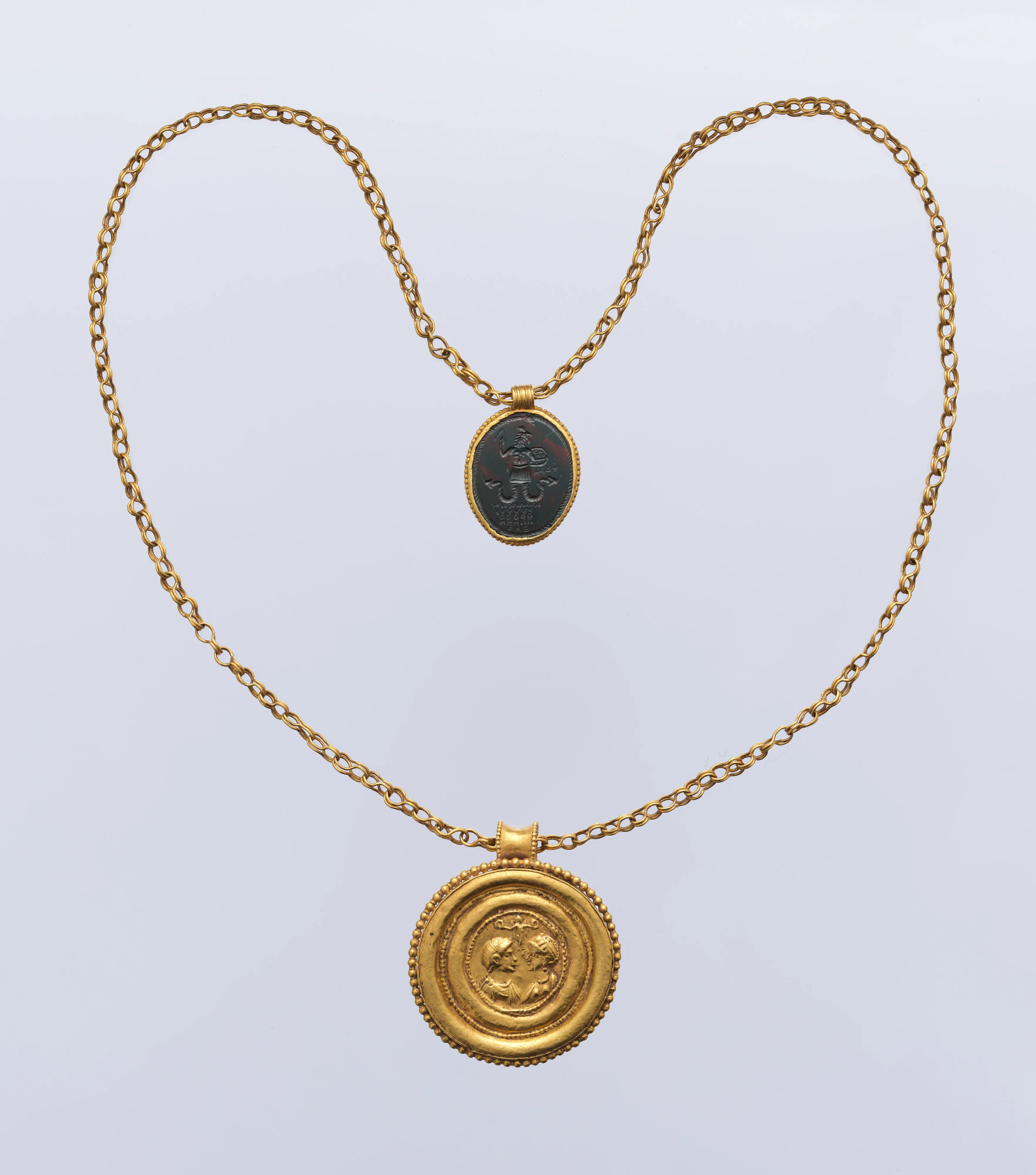 Necklace with Gold Marriage Medallion and Hematite Amulet — Unknown