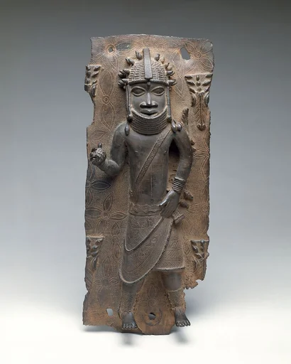 Plaque: Titleholder with Calabash Rattle