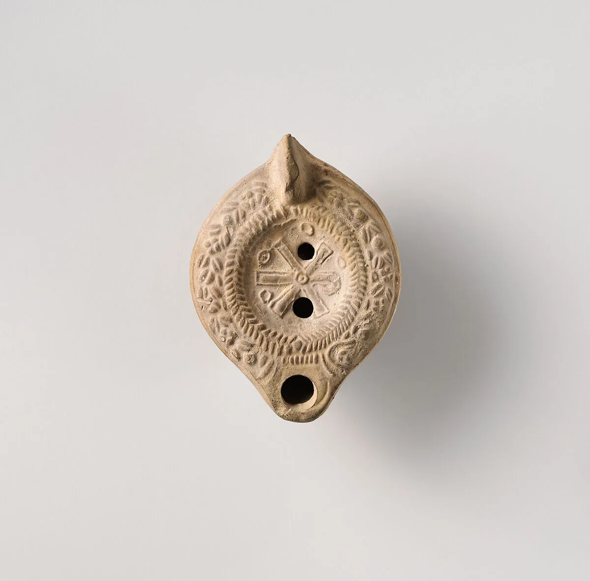 Terracotta oil lamp — Unknown