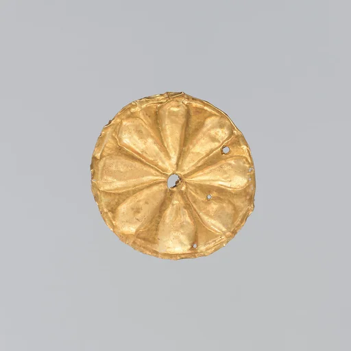 Gold roundel with stamped designs