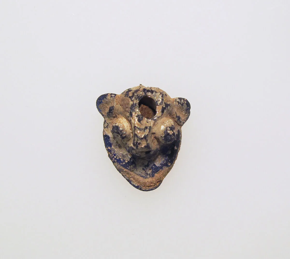 Glass pendant in the form of a demonic mask — Unknown