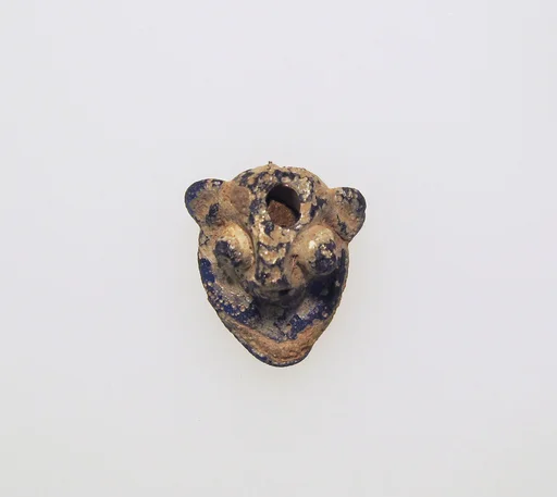 Glass pendant in the form of a demonic mask