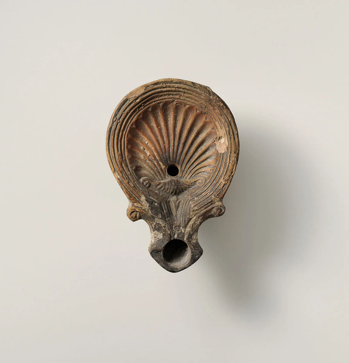 Terracotta oil lamp — Unknown