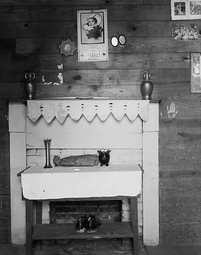 [Table, Fireplace, and Pictures on Wall of Floyd Burroughs's Bedroom, Hale County, Alabama]