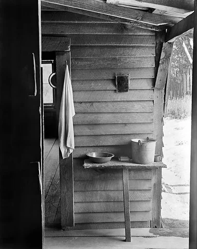 [Washstand with Pail, Bowl, and Mirror in Dog Run of Burroughs Home, Hale County, Alabama]