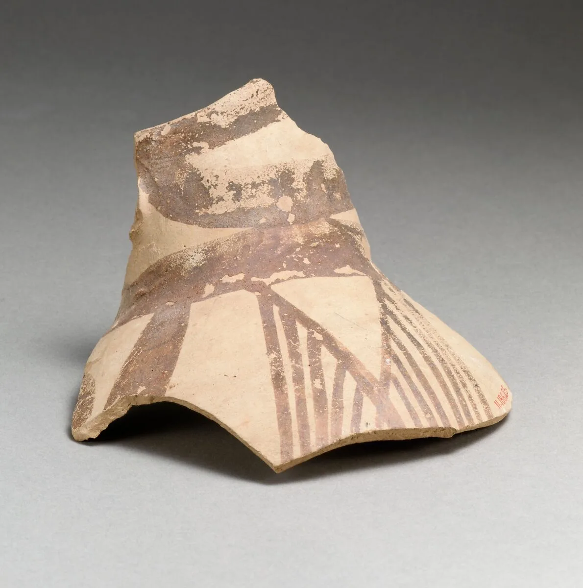 Terracotta jug fragment with bands and hatched triangles — Unknown