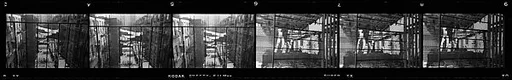 [Two 35mm Film Frames: Views of Laundry Lines Behind Apartment Buildings]