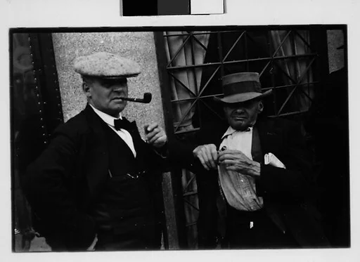 [Two 35mm Film Frames: Men on Street, Ossining, New York]