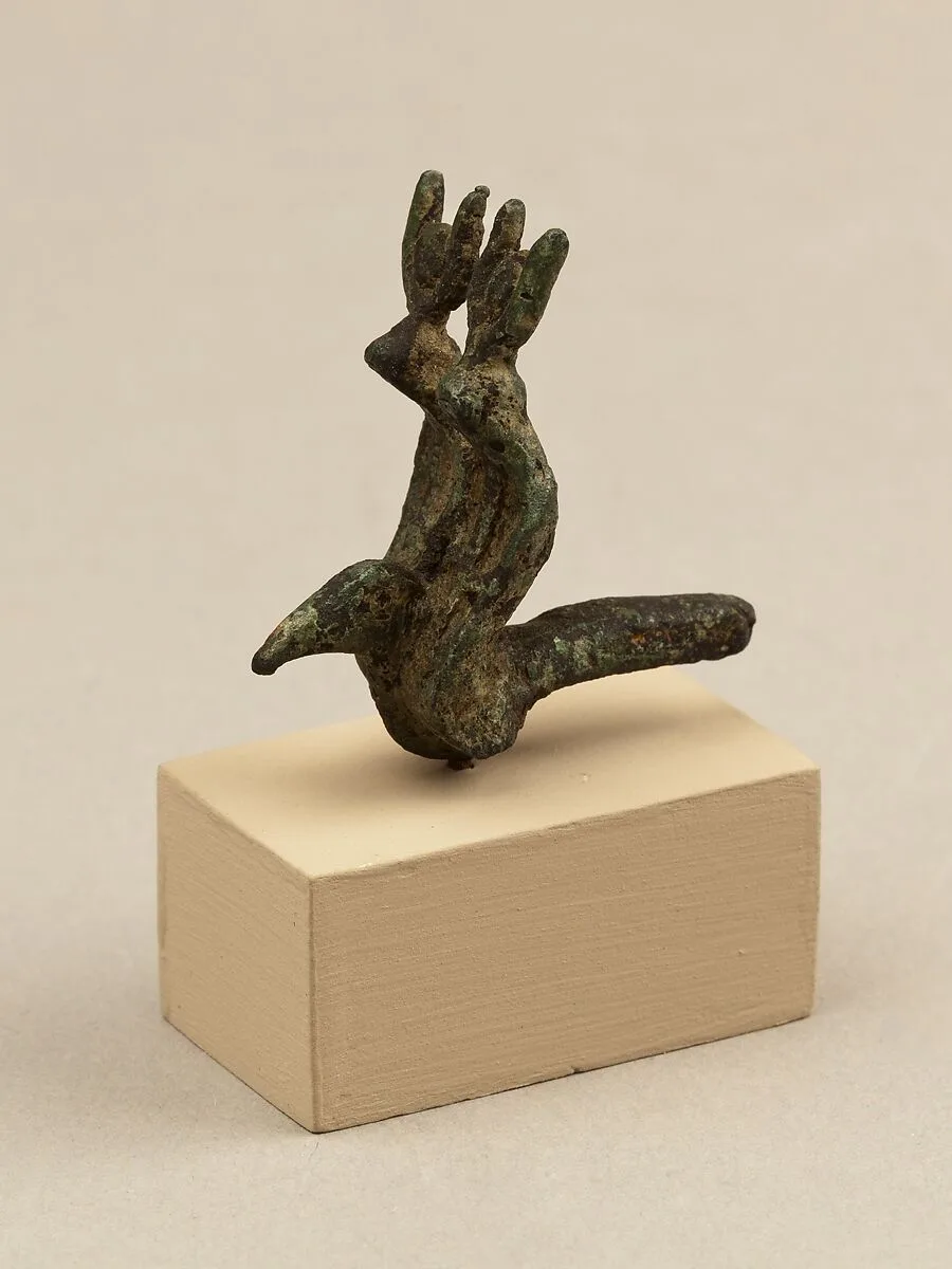 Vulture head and double uraei with disk and horn crowns, from statue of a goddess — Unknown