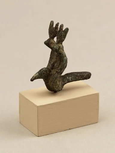 Vulture head and double uraei with disk and horn crowns, from statue of a goddess