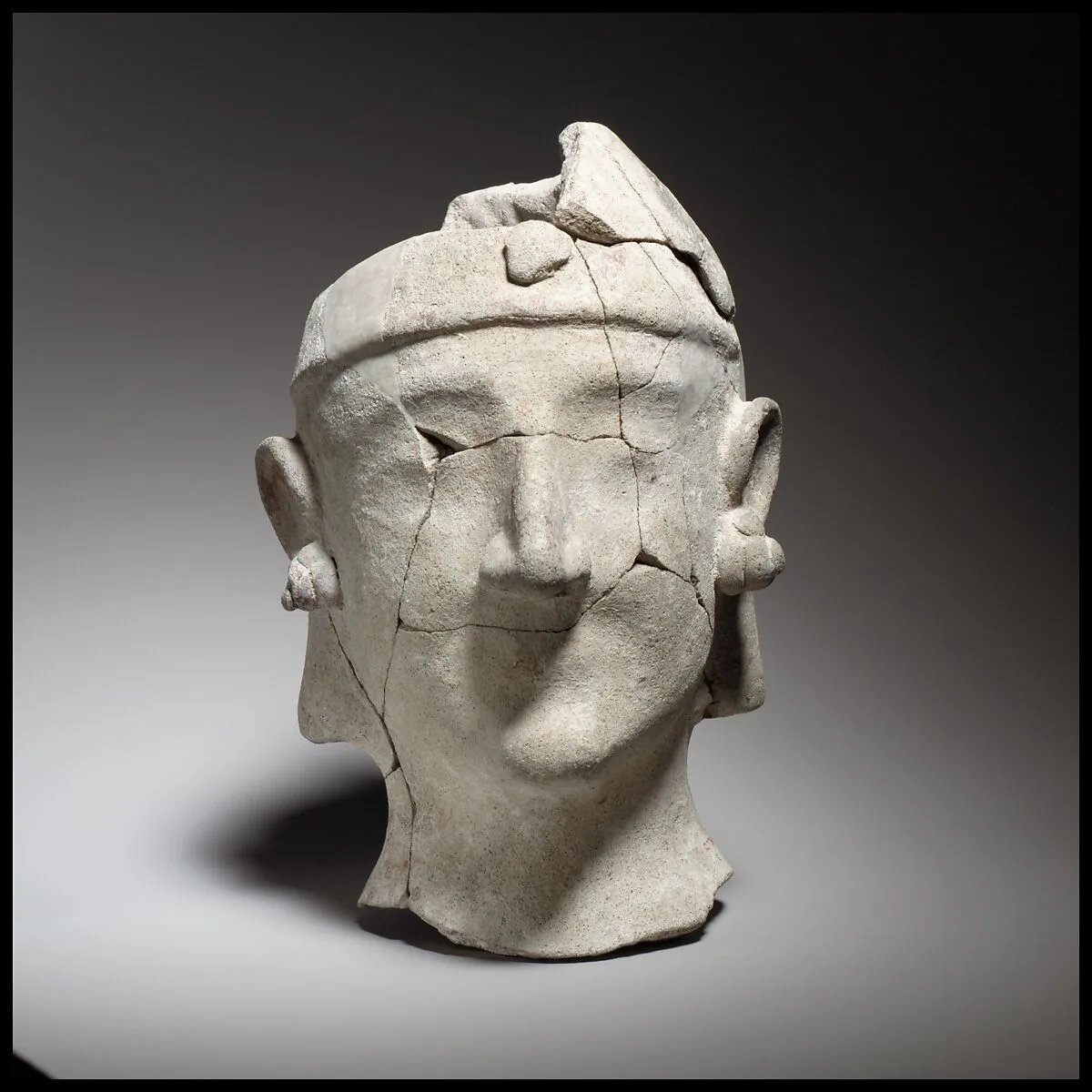Beardless male head wearing a helmet — Unknown