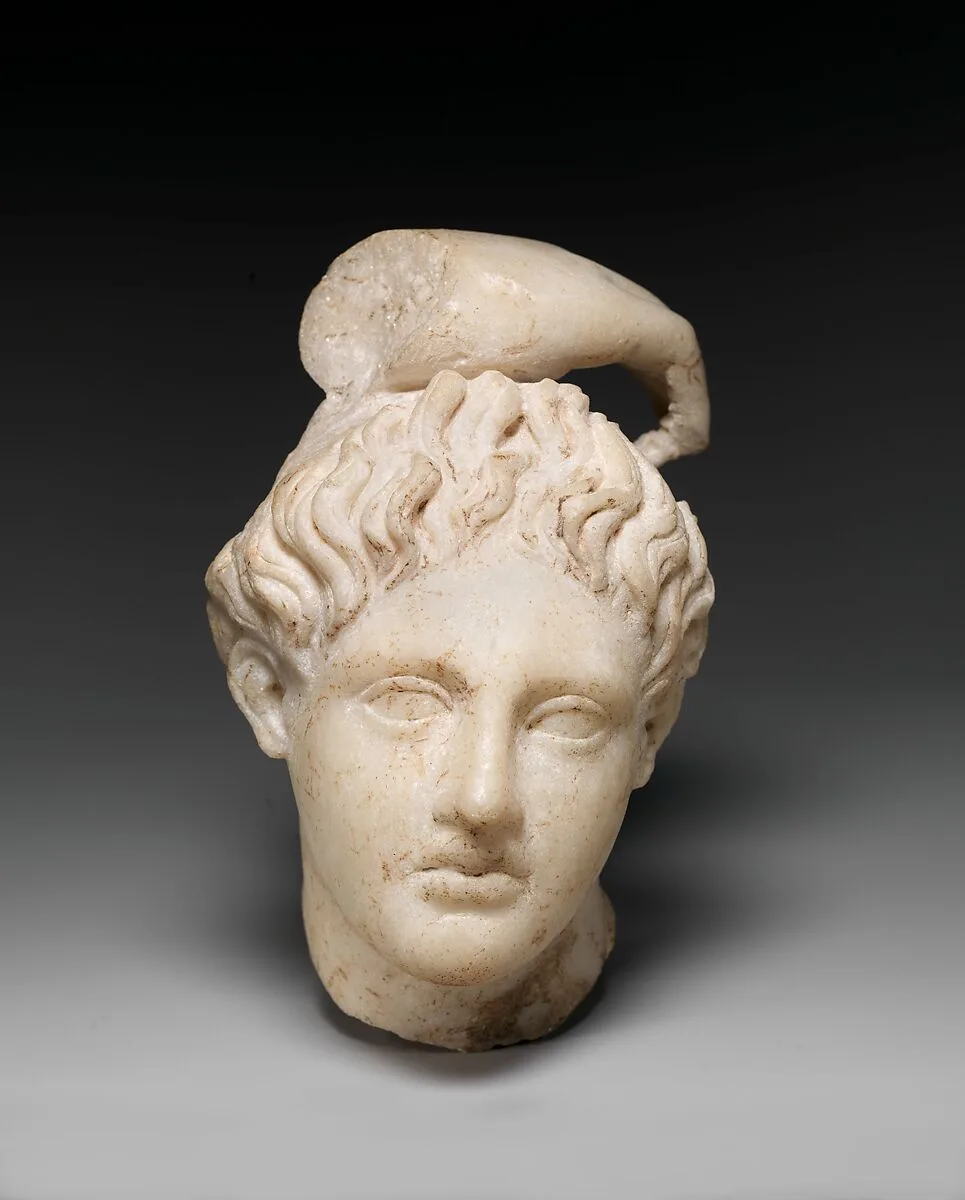 Marble head of Apollo with fragment of his hand — Unknown