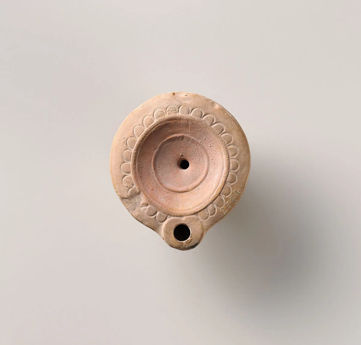 Terracotta oil lamp — Unknown