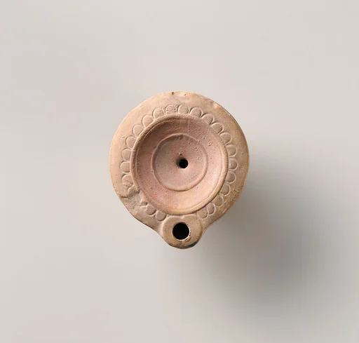 Terracotta oil lamp