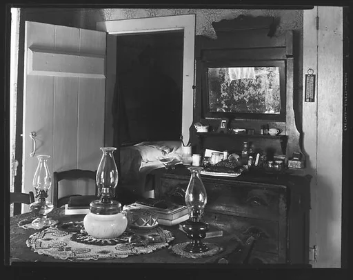 [Interior with Dressing Stand and Table with Three Kerosene Lamps, Near Copake, New York]