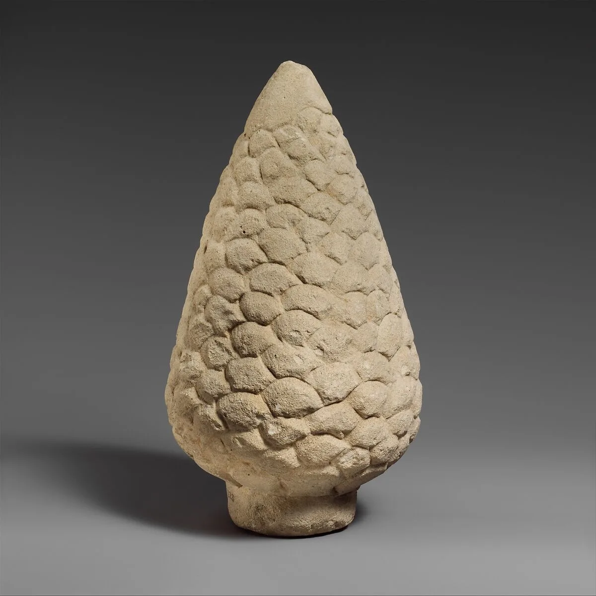 Limestone pinecone from a funerary cippus — Unknown