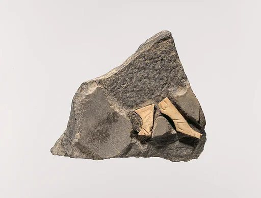 Plaque with animal legs