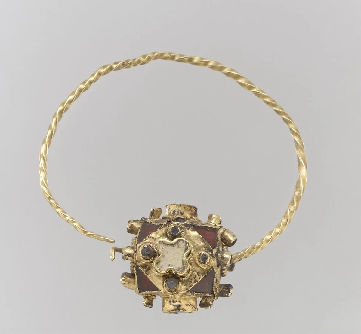 One of a Pair of Gold Earrings with Garnets — Unknown