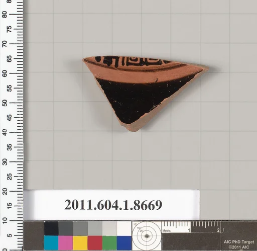 Terracotta fragment of a stemless kylix (drinking cup)