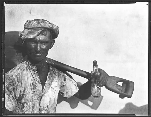 [Dockworker with Shovel and Bottle, Havana]