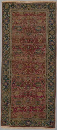 Indo-Persian carpet with vine scroll and palmette pattern