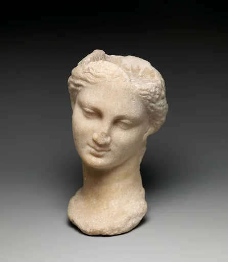 Marble head of a girl from a small statue