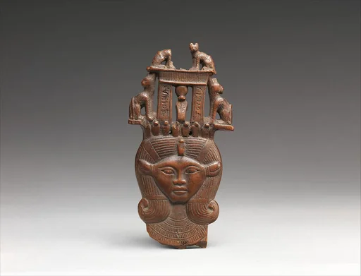 Head of Hathor from a clapper the inscription calling the musician who used it "beloved by the goddess Mut , Lady of Isheru (Karnak)