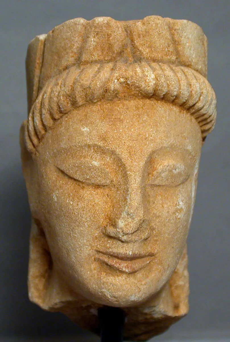 Limestone male head with wreath — Unknown