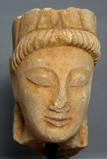 Limestone male head with wreath