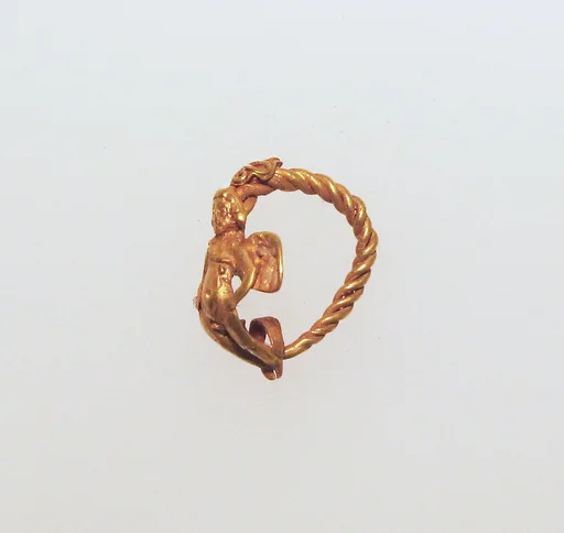 Gold earring with winged Eros