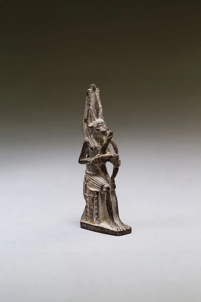 Seated polymorphic figure of jackal-headed archer — Unknown