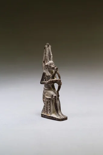 Seated polymorphic figure of jackal-headed archer