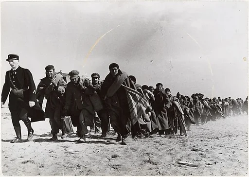[Group of Refugees Marching on Dirt Road]