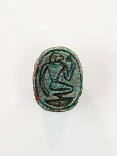 Scarab depicting a kneeling man (?)