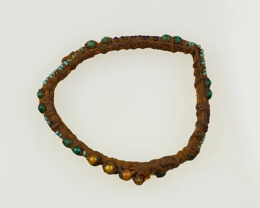 Bracelet of beads strung on fiber
