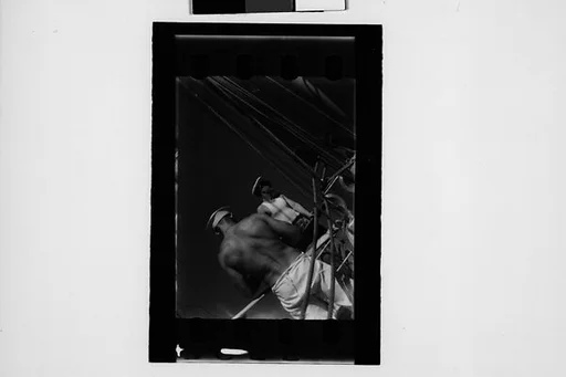 [South Seas: Motion Picture Film Frame of Cressida Lines and Sailor, From Behind]