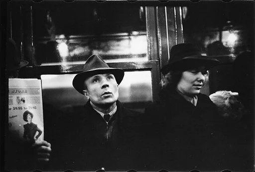 [Three 35mm Film Frames: Subway Passengers, New York City: Man in Hat Next to Woman, Man in Hat]