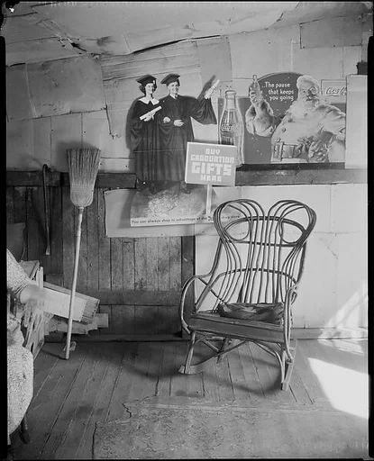 [Interior of Coal Miner's Home with Rocking Chair and Advertisements on Wall, West Virginia]