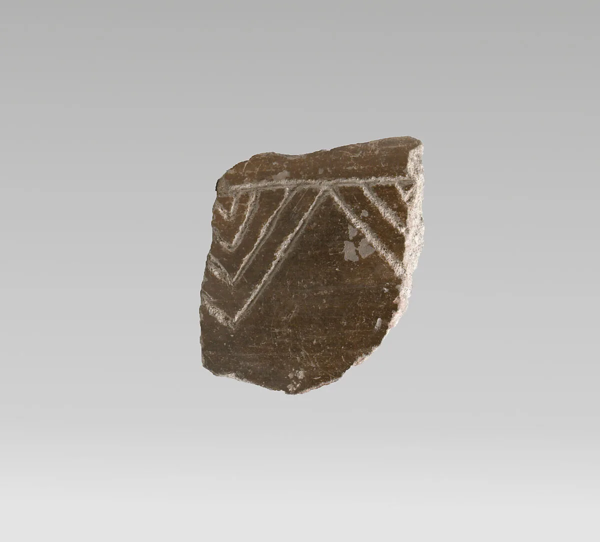 Terracotta vessel fragment with incised decoration — Unknown