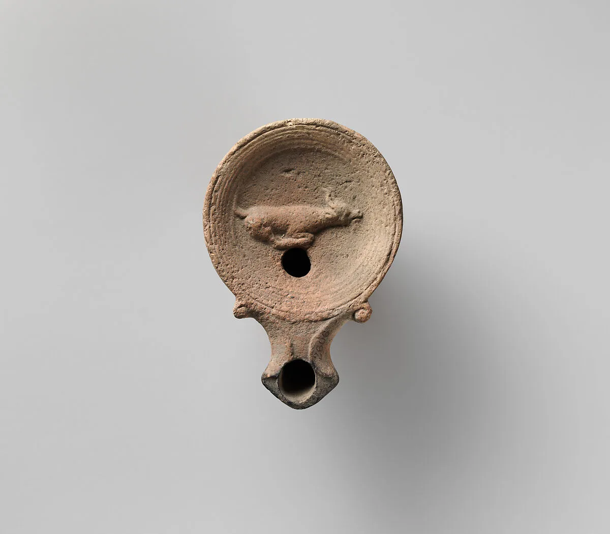 Terracotta oil lamp — Unknown