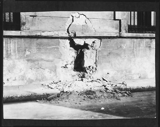 [Copy of Newspaper File Photograph: Bombed Wall, Probably Havana]