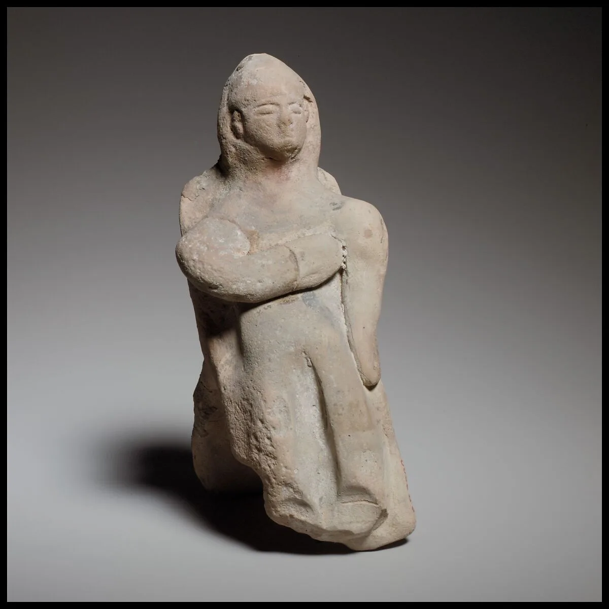 Seated female figurine — Unknown