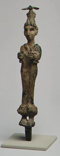 Goddess wearing a headdress surmounted by a bird