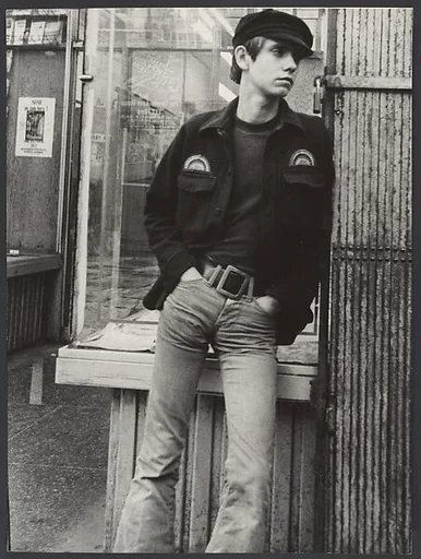 [Street Scene: Young Man Leaning against Shopfront Window, New York City?]