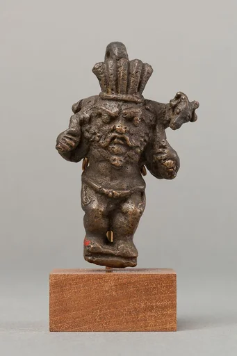 Bes carrying a ram over his shoulders