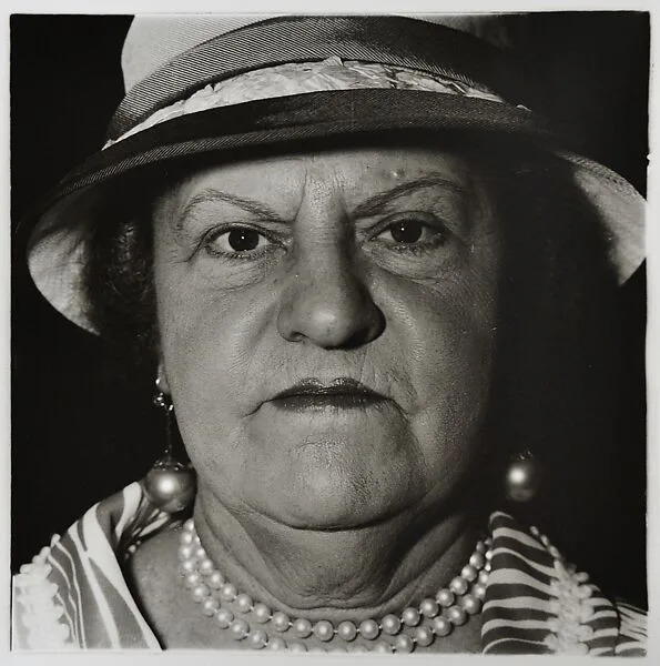 A woman with pearl necklace and earrings, N.Y.C — Diane Arbus|Neil Selkirk