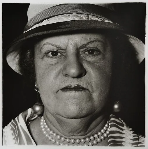 A woman with pearl necklace and earrings, N.Y.C